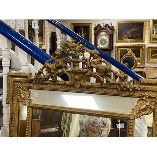 172 - A French giltwood and composition overmantel mirror with floral cherub pediment width 91cm, height 1... 