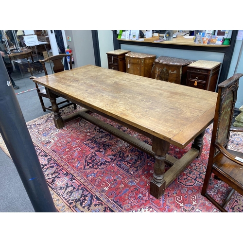 212 - An 18th century style rectangular oak refectory dining table, length 242cm, width 106cm, height 80cm... 