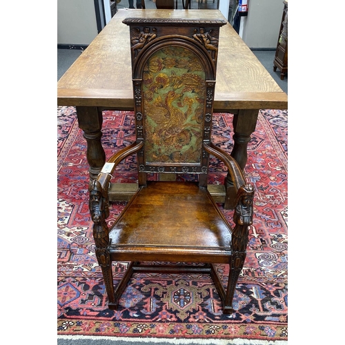 214 - A 20th century carved mahogany cacqueteuse (armchair) with painted leather panelled back, width 54cm... 