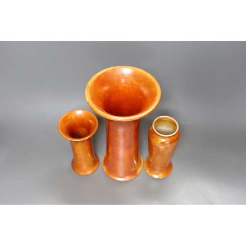 250 - A group of three Ruskin orange lustre vases, largest 25cm