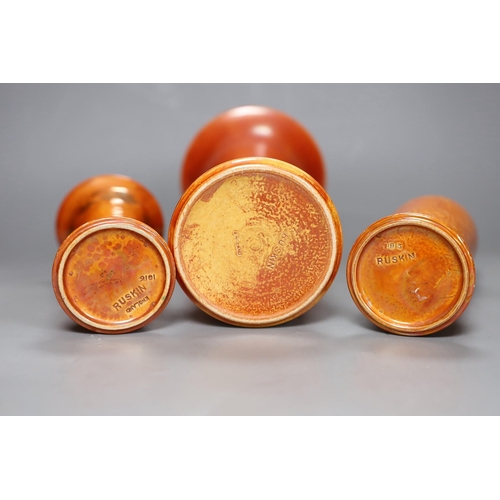 250 - A group of three Ruskin orange lustre vases, largest 25cm