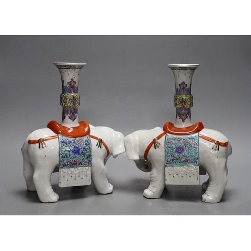 258 - A pair of Chinese enamelled porcelain elephant vases, 27cm high