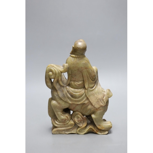 260 - A Chinese soapstone group of a luohan riding a lion, 20cm