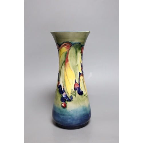 264 - A Moorcroft leaf and berry vase, 26cm