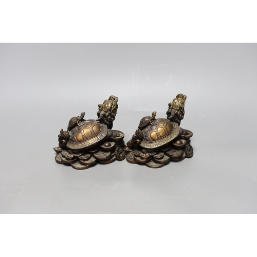 270 - Two Chinese bronze models of dragon turtles on a pile of cash, 10cm