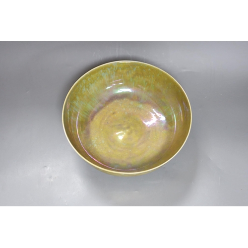 285 - A Ruskin thinly potted green and ochre lustre fruit bowl, dated 1923, 25cm diameter