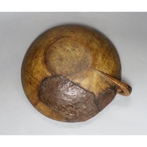 294 - A carved elm mazer bowl, with old blacksmith repair, 31cm diameter