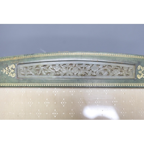 300 - An early 20th century tooled photograph frame with inset Chinese pierced bowenite jade panel, 43cm t... 