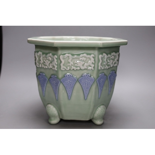 305 - A Japanese celadon ground porcelain jardiniere, 26cm tall