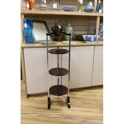 313 - A Bakelite and chrome cake stand, 93cm