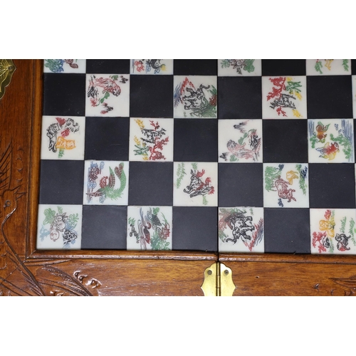 315 - A Chinese chess set with resin pieces, 39x39cm