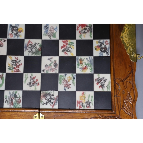 315 - A Chinese chess set with resin pieces, 39x39cm