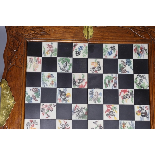 315 - A Chinese chess set with resin pieces, 39x39cm