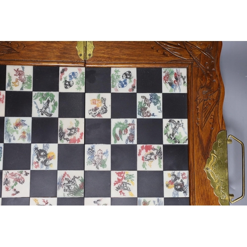 315 - A Chinese chess set with resin pieces, 39x39cm