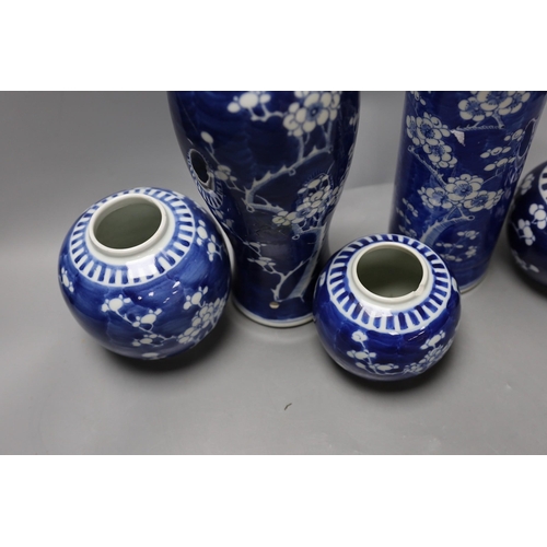 333 - Two 19th / 20th century Chinese blue and white prunus vases and three jars, tallest 29cm