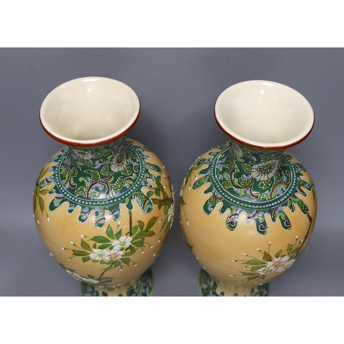 350 - A pair of Japanese Satsuma style cream ground moriage vases, 40cm