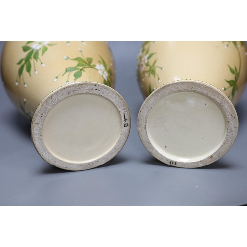 350 - A pair of Japanese Satsuma style cream ground moriage vases, 40cm