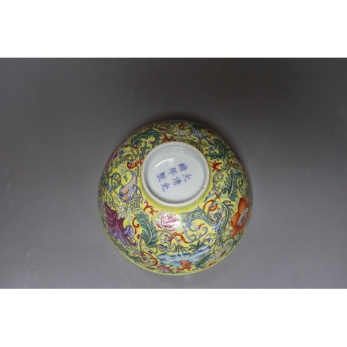 365 - A Chinese yellow ground famille rose floral bowl, 15cm