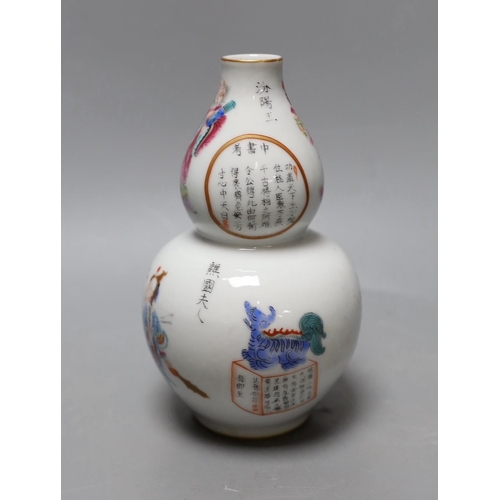 369 - A Chinese famille rose gourd vase. 18cm high