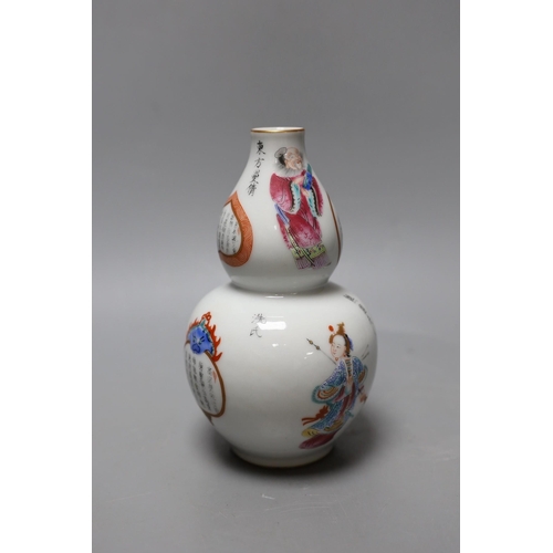 369 - A Chinese famille rose gourd vase. 18cm high