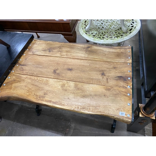 37 - A Victorian style painted cast metal and oak rectangular garden table, width 100cm, height 67cm... 