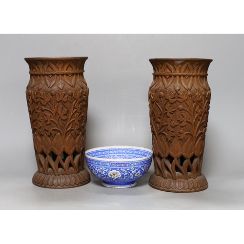 373 - A pair of Indian carved wood vases, 22.5cm high, and a Persian blue enamel bowl (3)