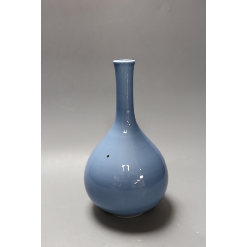 385 - A Chinese claire du lune glazed bottle vase. 26cm tall