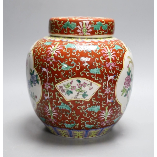 407 - A Chinese coral ground jar and cover, 23cm