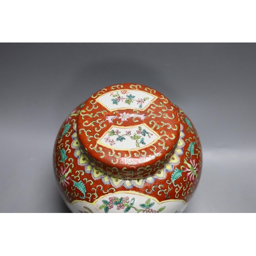 407 - A Chinese coral ground jar and cover, 23cm