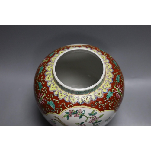 407 - A Chinese coral ground jar and cover, 23cm