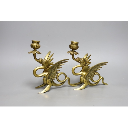 409 - A pair of Griffin candlesticks, 19cm