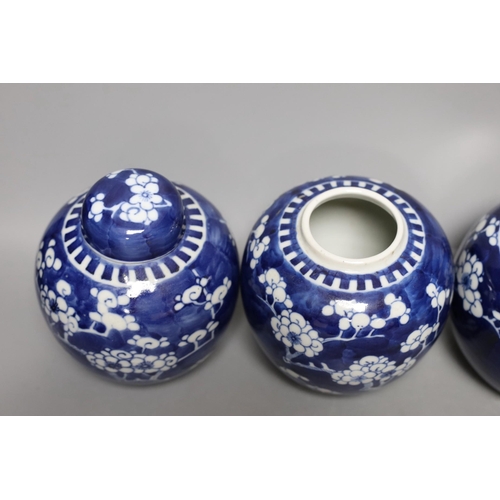 411 - Four 19th / early 20th century Chinese blue and white prunus jars, 14cm