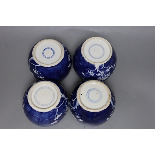 411 - Four 19th / early 20th century Chinese blue and white prunus jars, 14cm