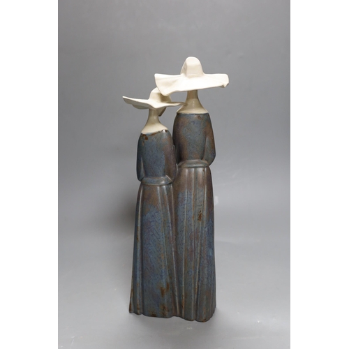 416 - A Lladro stoneware group of two nuns, 34 cm high, boxed