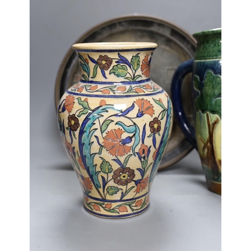 417 - A Dutch jug, a polychrome vase and a Maresch Musterschutz moulded wall plaque, 33 cm diameter