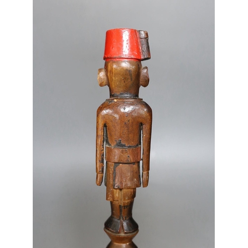 428 - An early 20th century Nyassaland figural carved walking cane (Kings African Rifles) 87cm long