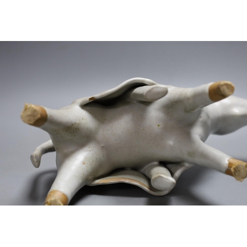 444 - An abstract studio pottery figure of man on a donkey. 43cm high