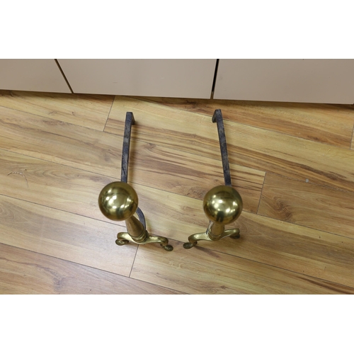 477 - A pair of brass andirons. 57cm high