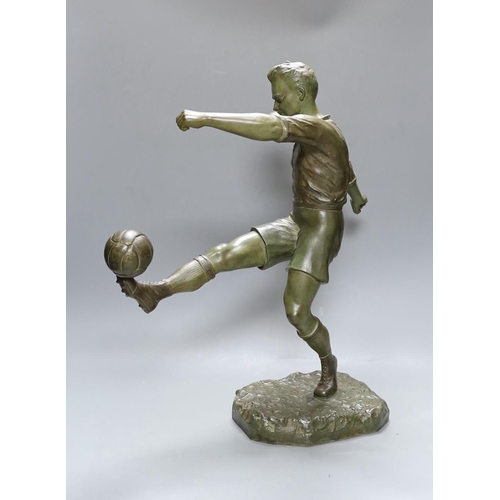 493 - H. Fugere. A large patinated spelter figure of a  football player, 50cm tall