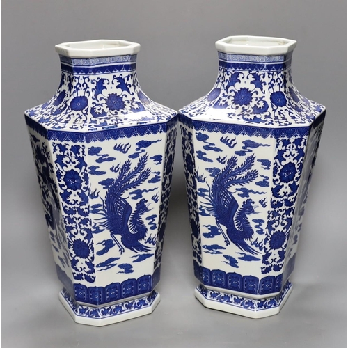 494 - A pair of large Chinese blue and white dragon vases, 40cm