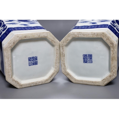 494 - A pair of large Chinese blue and white dragon vases, 40cm