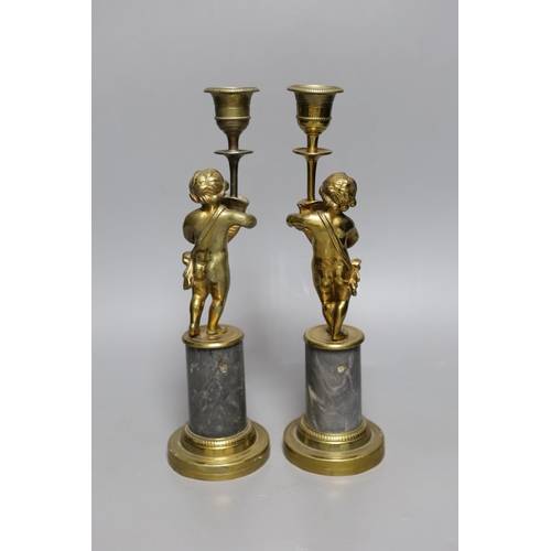 503 - A pair of early 20th century gilt brass figural candlesticks, 27.5cm