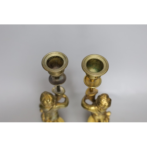 503 - A pair of early 20th century gilt brass figural candlesticks, 27.5cm