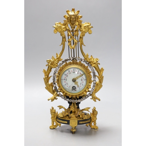 505 - An early 20th century French ormolu mounted miniature lyre clock, 24 cm time