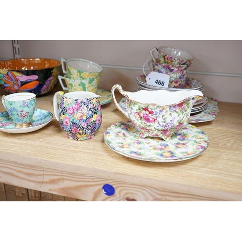 513 - A Clarice Cliff tea cup, a collection of chintz patterned teaware, a lustre bowl and a honey pot and... 