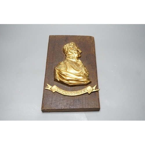 522 - A gilt metal Wellington plaque on wooden panel, 30 x 19cm