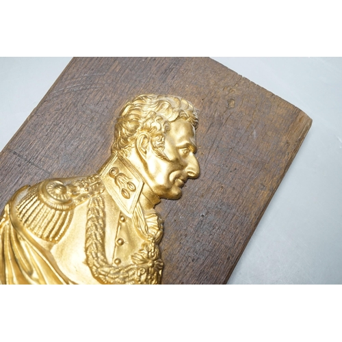 522 - A gilt metal Wellington plaque on wooden panel, 30 x 19cm