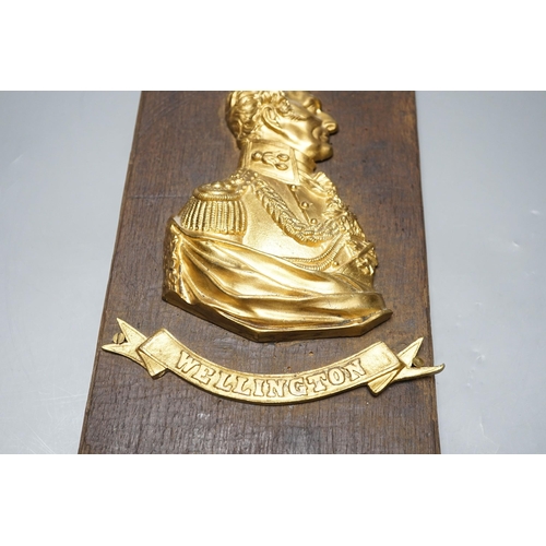 522 - A gilt metal Wellington plaque on wooden panel, 30 x 19cm