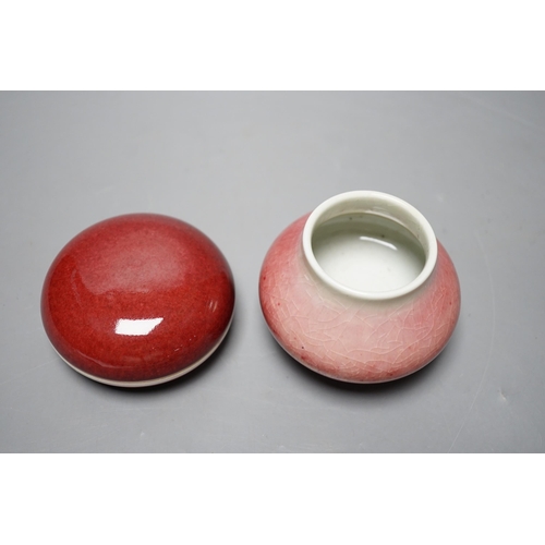 527 - A Chinese sang de boeuf glazed seal paste box and a small pot (2) box 7.5cm diameter