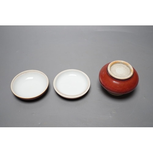 527 - A Chinese sang de boeuf glazed seal paste box and a small pot (2) box 7.5cm diameter